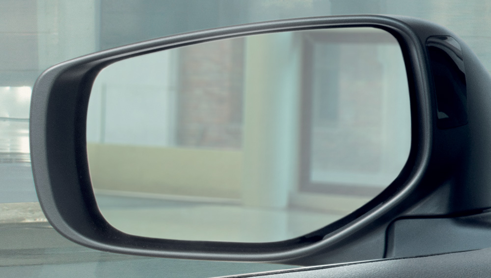 Closeup of 2024 Subaru Legacy door mirror with SRVD indicator.
