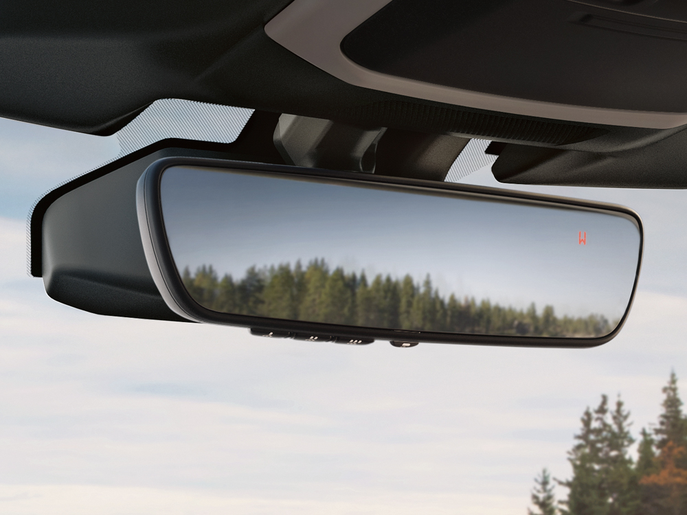 Close up shot of auto-dimming rearview mirror with Homelink<sup>®</sup> and compass.