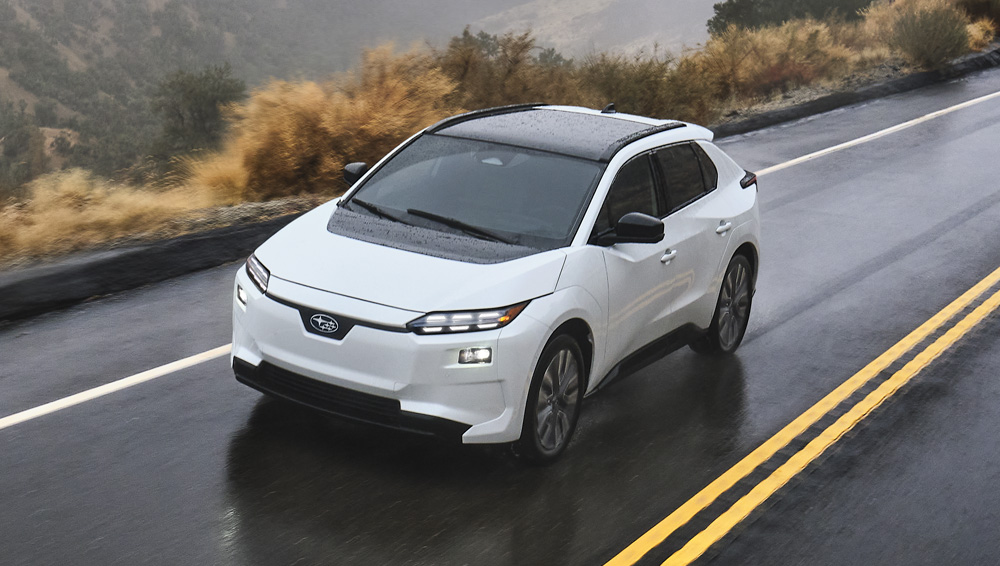 2026 Solterra driving through a muddy puddle.