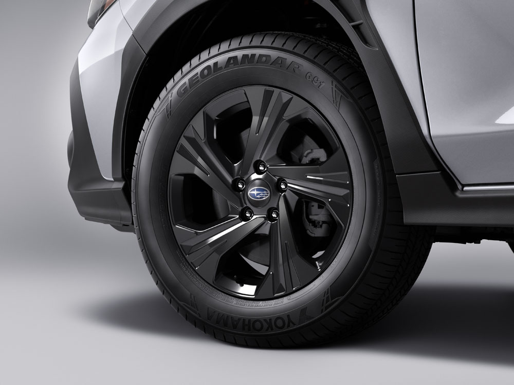 Close up of 17-inch black painted aluminum alloy wheels.