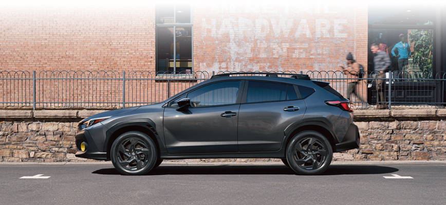 Subaru Crosstrek at a mountain overlook with rear liftgate open